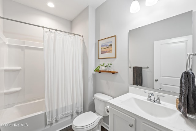 full bathroom with toilet, vanity, and shower / tub combo with curtain