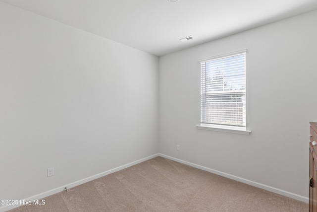 unfurnished room with carpet flooring