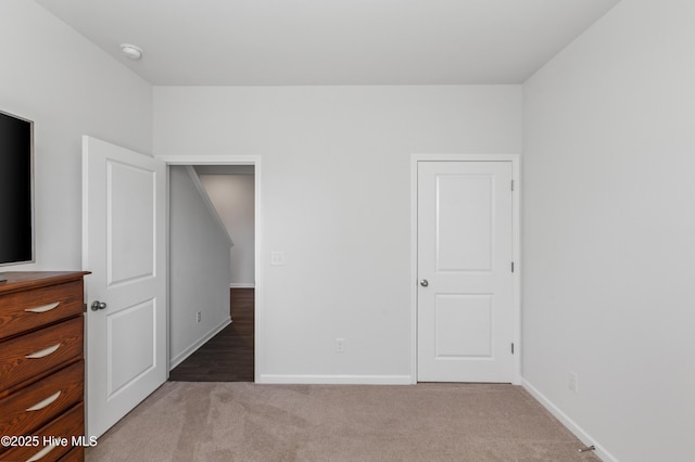 unfurnished bedroom with carpet floors