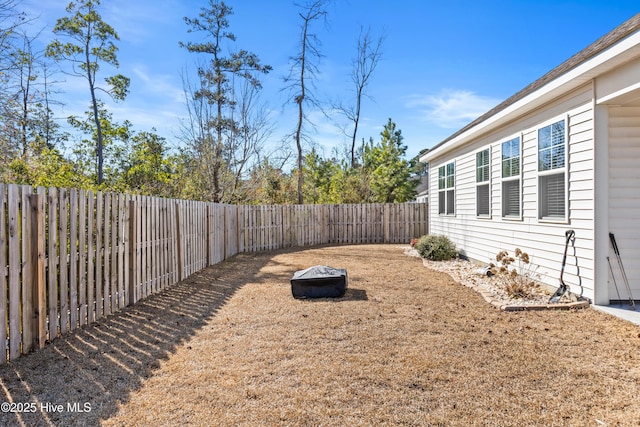 view of yard with an outdoor fire pit