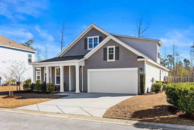 view of front of house with a garage and a porch