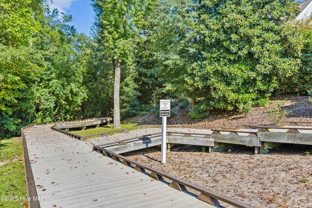 view of dock featuring a gazebo and a water view