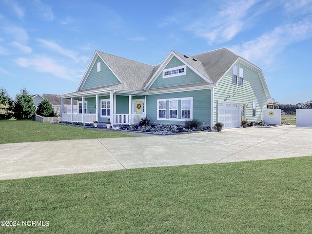 view of front of home featuring covered porch, driveway, a front lawn, and a garage