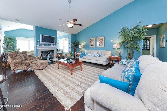 living room with plenty of natural light, ceiling fan, hardwood / wood-style floors, and lofted ceiling