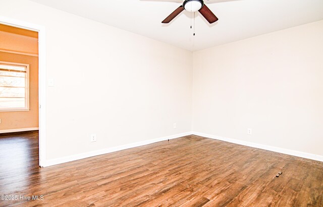 empty room with hardwood / wood-style flooring and ceiling fan