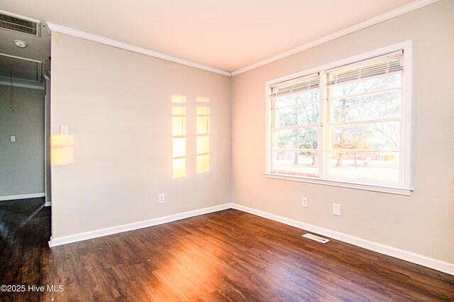 unfurnished room with dark hardwood / wood-style flooring and crown molding