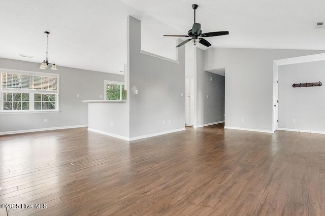 unfurnished living room featuring dark hardwood / wood-style flooring, high vaulted ceiling, and ceiling fan