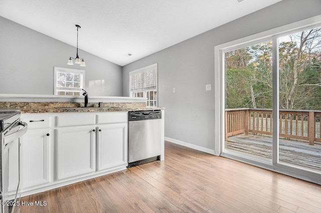 kitchen featuring white cabinets, vaulted ceiling, sink, pendant lighting, and dishwasher