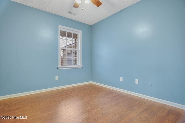 unfurnished room featuring light hardwood / wood-style floors and ceiling fan