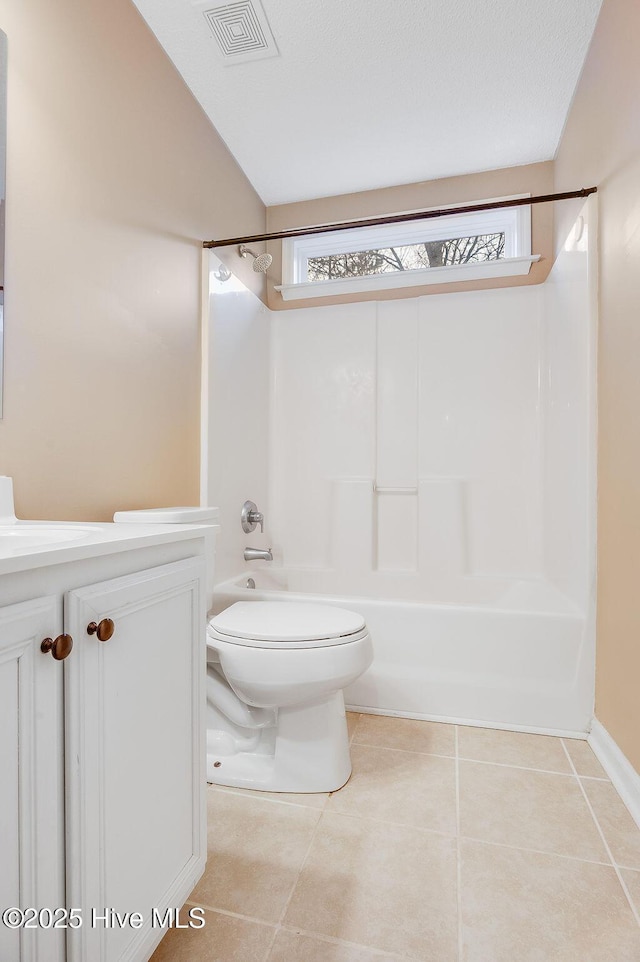 full bathroom with tile patterned floors, vanity, shower / bath combination, and toilet