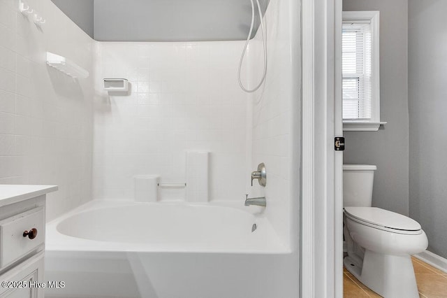 full bathroom featuring tile patterned floors, vanity, toilet, and tub / shower combination