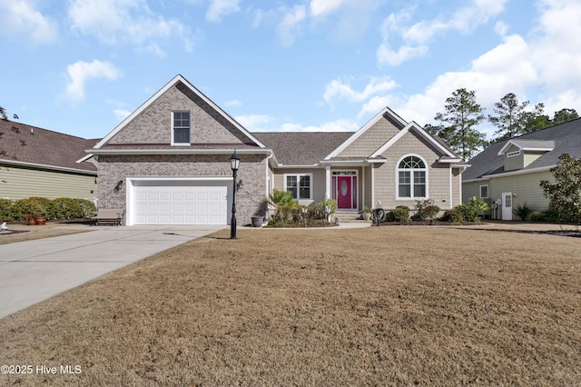 view of front of home featuring a front yard and a garage