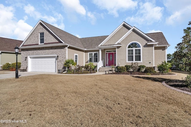 view of front of home with a garage and a front yard