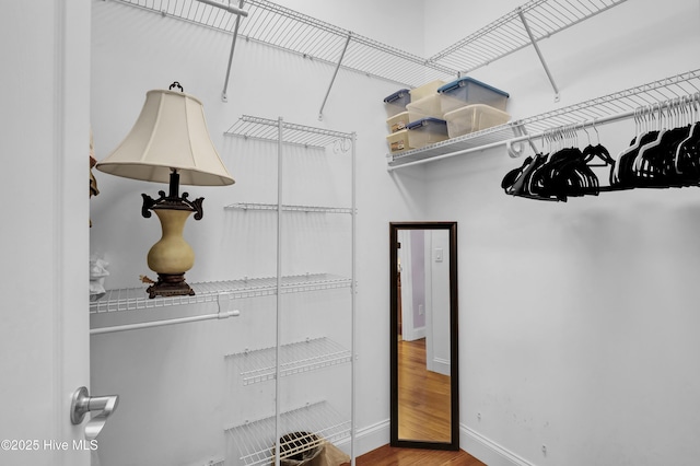 walk in closet featuring hardwood / wood-style floors