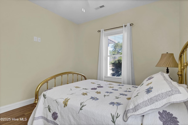 bedroom featuring dark hardwood / wood-style floors