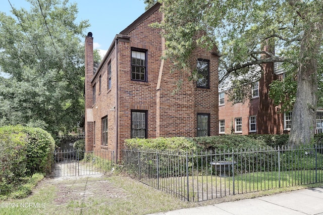 view of side of home featuring a yard