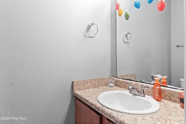 bathroom with vanity and toilet