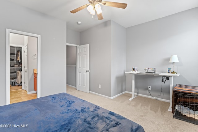 bedroom with ceiling fan and light carpet