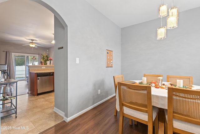 dining area with ceiling fan and light tile patterned floors