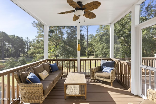 sunroom / solarium featuring ceiling fan and a healthy amount of sunlight