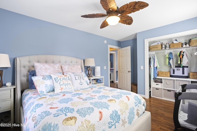 bedroom featuring ceiling fan, a closet, baseboards, and wood finished floors