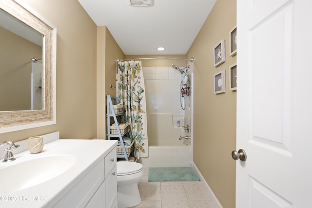 bathroom featuring toilet, shower / bath combo, vanity, baseboards, and tile patterned floors