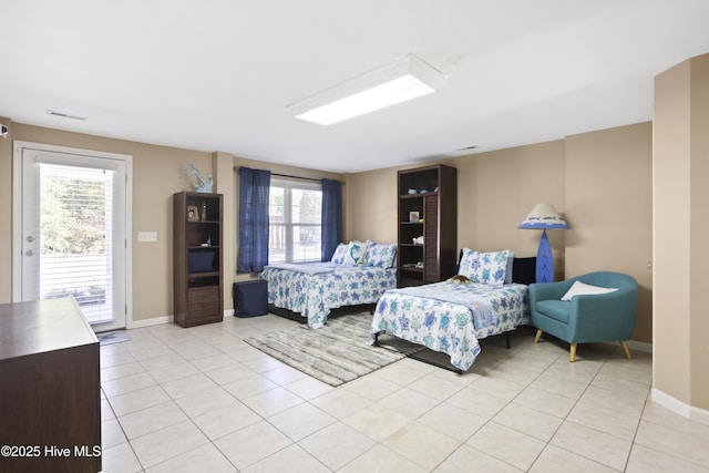 bedroom featuring access to exterior, visible vents, baseboards, and light tile patterned floors