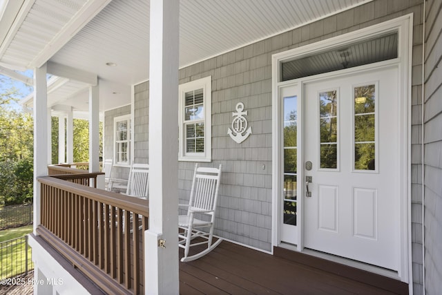 entrance to property featuring a porch