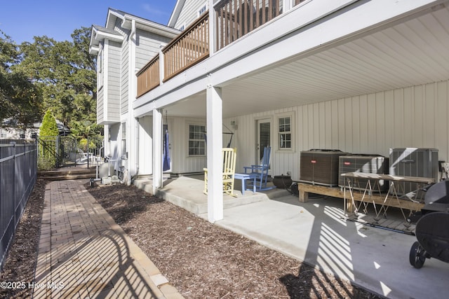 view of patio / terrace featuring cooling unit and fence