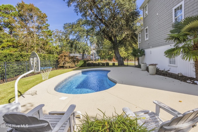 view of pool with a patio area, a fenced backyard, a fenced in pool, and a yard