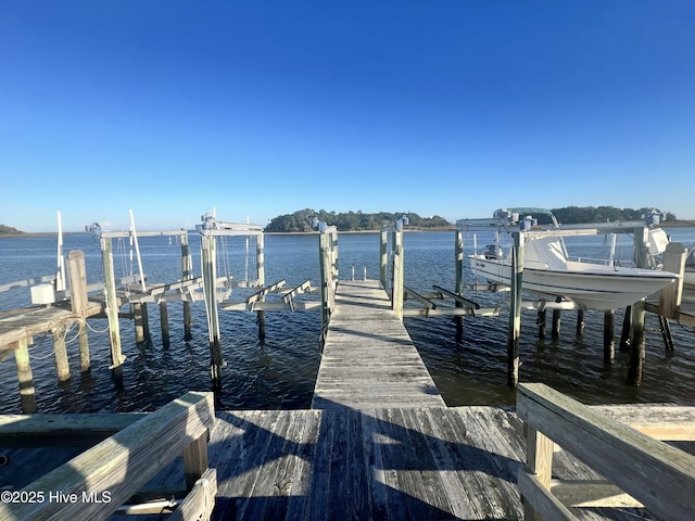 view of dock with a water view and boat lift