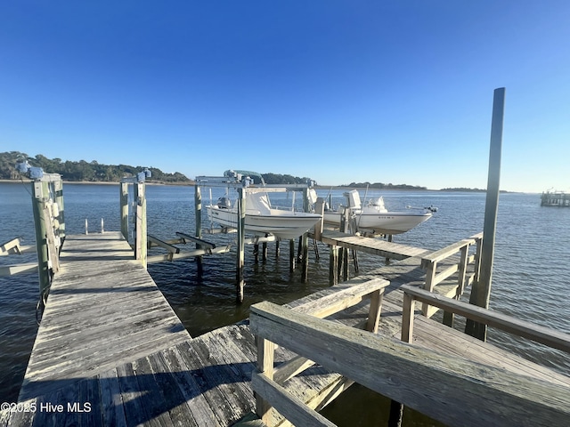 dock area featuring a water view and boat lift