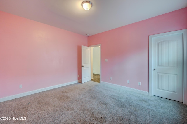 unfurnished bedroom with light colored carpet