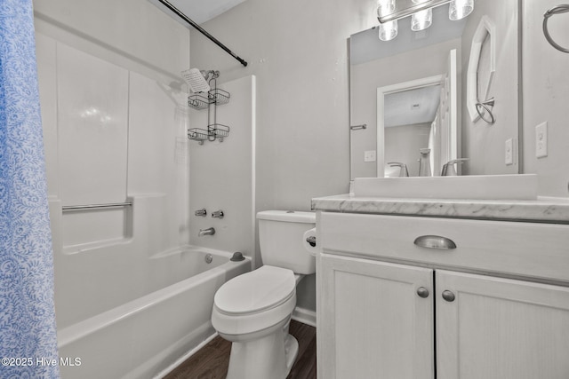 full bathroom with hardwood / wood-style floors, vanity, toilet, and shower / bath combo