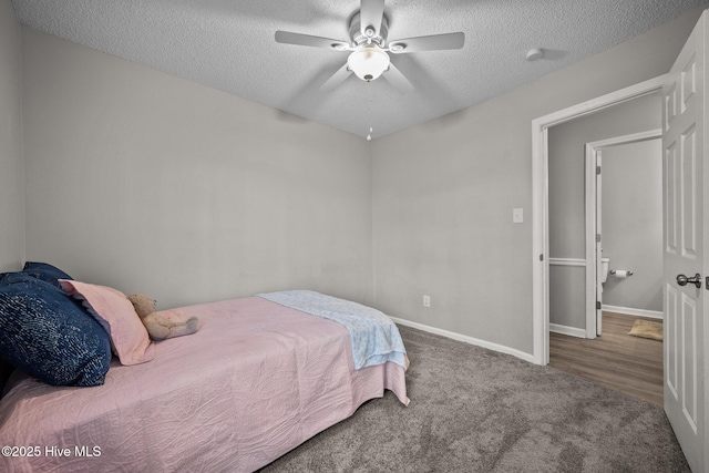 carpeted bedroom with a textured ceiling and ceiling fan