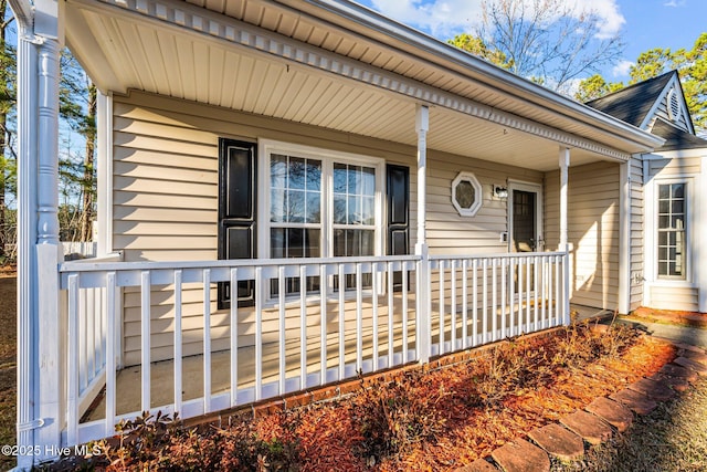 doorway to property with a porch