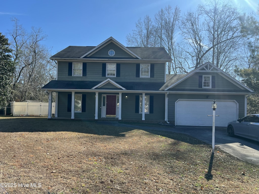 view of front of home with a porch and a garage