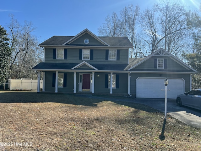 view of front of home with a porch and a garage