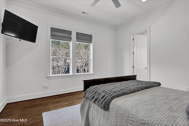 bedroom featuring ceiling fan, dark hardwood / wood-style flooring, and ornamental molding