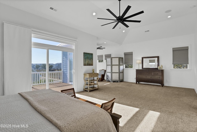 carpeted bedroom featuring access to exterior and lofted ceiling