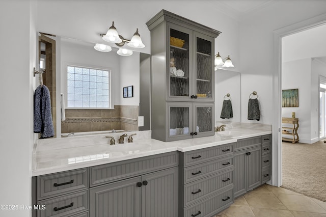 bathroom featuring tile patterned floors, vanity, and ornamental molding