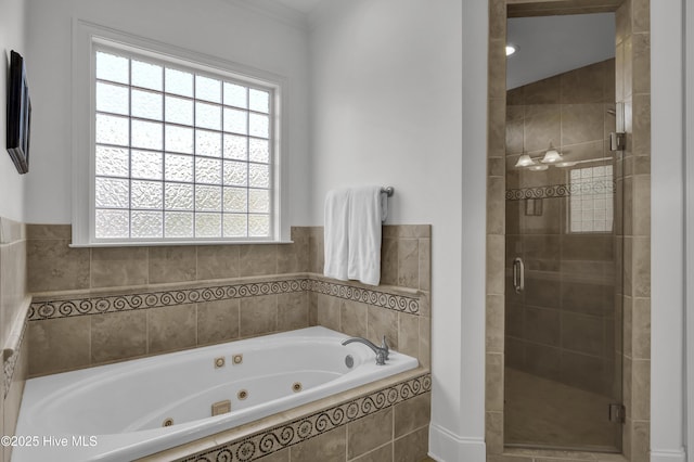 bathroom featuring shower with separate bathtub