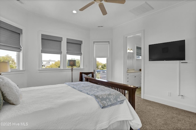 bedroom with carpet, ceiling fan, crown molding, and ensuite bath