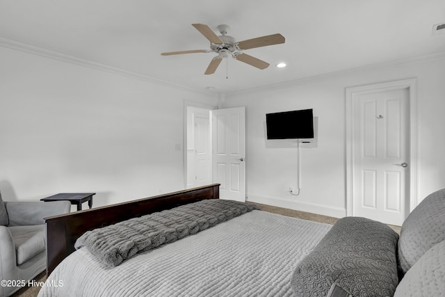 carpeted bedroom with crown molding and ceiling fan