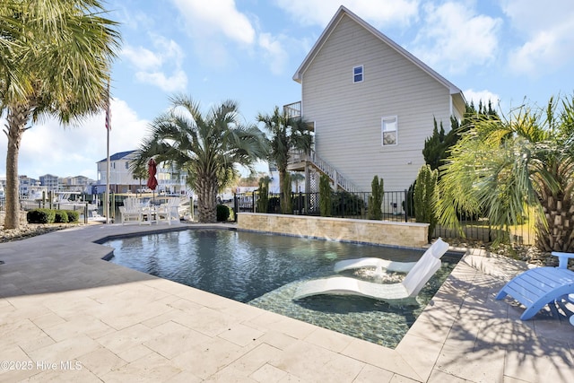 view of pool featuring a patio area and a jacuzzi