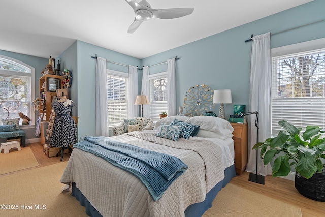 bedroom featuring ceiling fan and light hardwood / wood-style floors