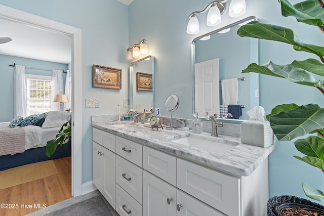 bathroom featuring vanity and hardwood / wood-style floors