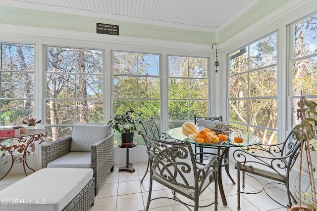 sunroom / solarium featuring a healthy amount of sunlight