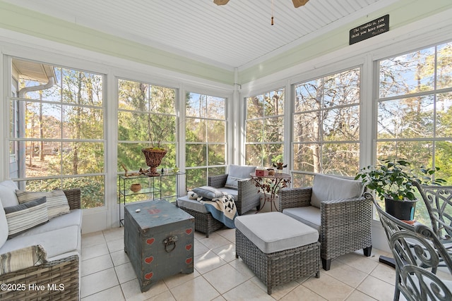 sunroom / solarium featuring ceiling fan and a healthy amount of sunlight