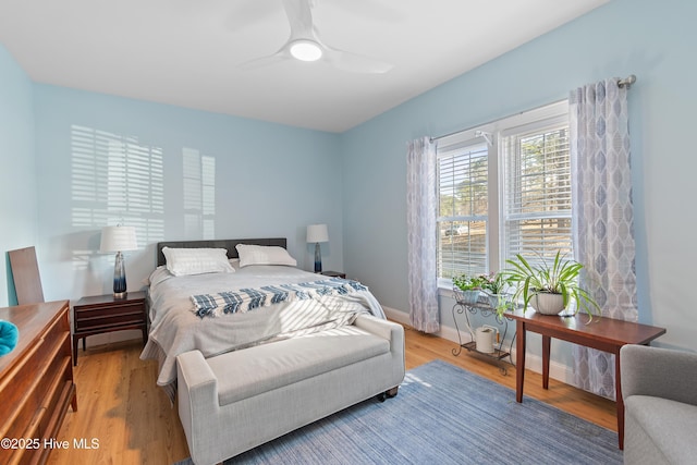 bedroom featuring ceiling fan and hardwood / wood-style floors